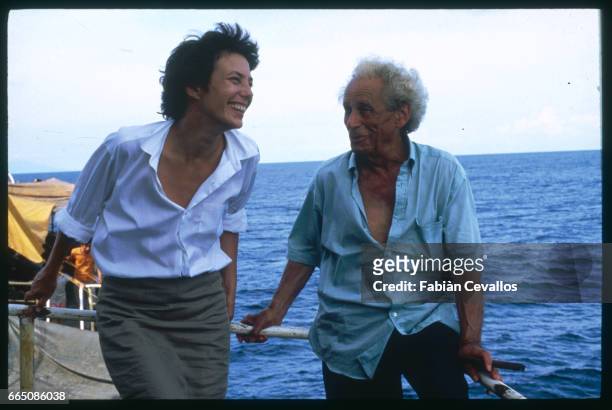 The British actress/singer Jane Birkin and American actor Samuel Fuller stand on the deck of a ship during the making of the 1988 French TV series...