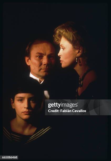 Austrian actor Klaus Maria Brandauer, American actress Faye Dunaway, and young David Eberts star in the 1988 movie Burning Secret, or Brennendes...
