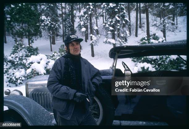 British director Andrew Birkin leans on a vintage automobile as he prepares a scene on the set of his 1988 movie Burning Secret, or Brennendes...