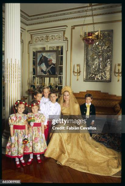 Bride Olga Rostropovich with flower girls and page boys standing and sitting in the foreground, during her wedding with Olaf Guerrand-Hermes at the...