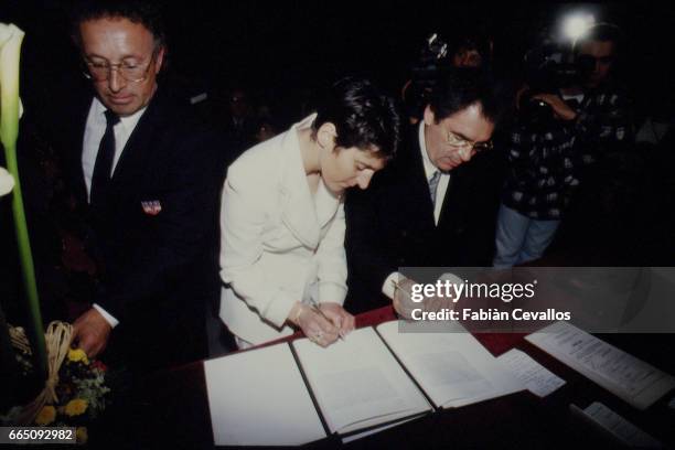 The couple signing at the City Hall of Toulouse.