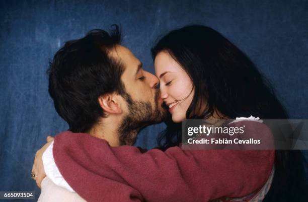 Actors Monica Keena and Gil Bellows smile and kiss on the set of the movie Snow White: A Tale of Terror . Directed by Michael Cohn, this movie tells...
