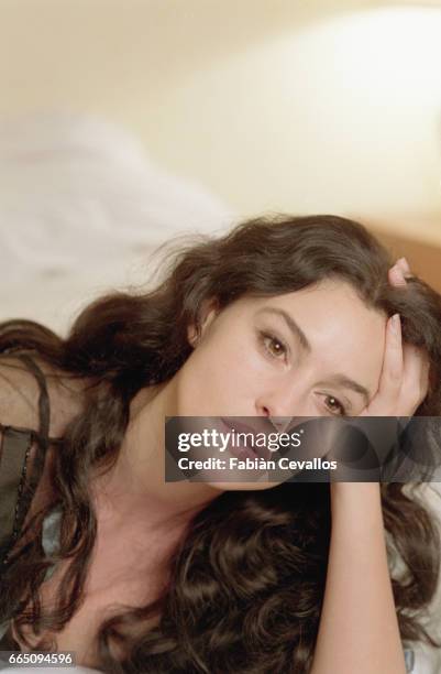Italian actress Monica Bellucci, with her hand in her hair, takes a break in her dressing room from the shooting of the Italian director Giuseppe...