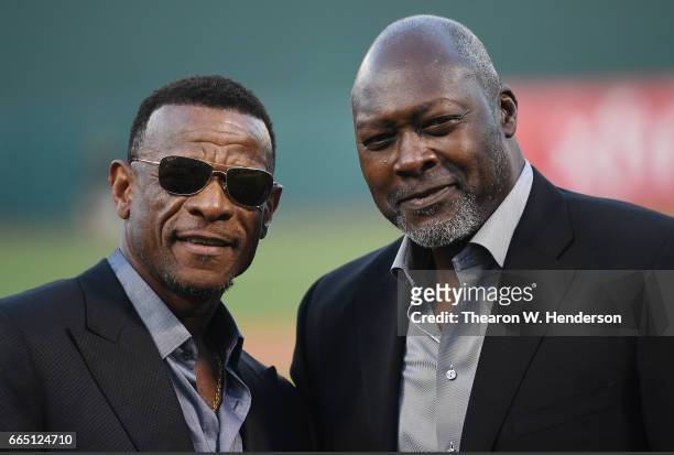 Former Oakland Athletics Rickey Henderson and Dave Stewart stands together after Henderson threw out the ceremonial first pitch prior to the start of...