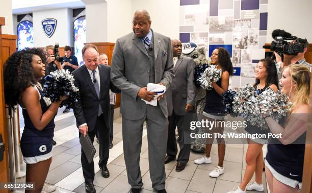 Patrick Ewing arrives with Georgetown University President John J. DeGioia for his press conference to be introduced as the new head coach of the...