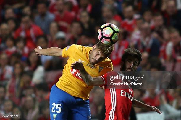 Estoril's midfielder Diogo Amado vies with Benfica's midfielder Rafa Silva during the Portuguese Cup football match between SL Benfica and Estoril...