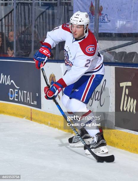 Stefan Matteau of the St. John's IceCaps fires the puck up ice against the Toronto Marlies during AHL game action on April 4, 2017 at Ricoh Coliseum...