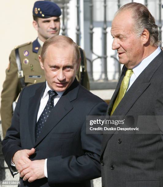 Spanish King Juan Carlos receives Russian President Vladimir Putin on his arrival at the El Pardo Palace in Madrid. | Location: MADRID, MADRID, SPAIN.