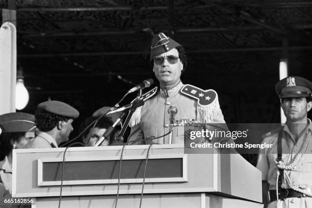 Libyan chief of state Muammar al-Qaddafi gives a speech during a 1981 graduation at the women's military academy in Tripoli. The academy opened in...