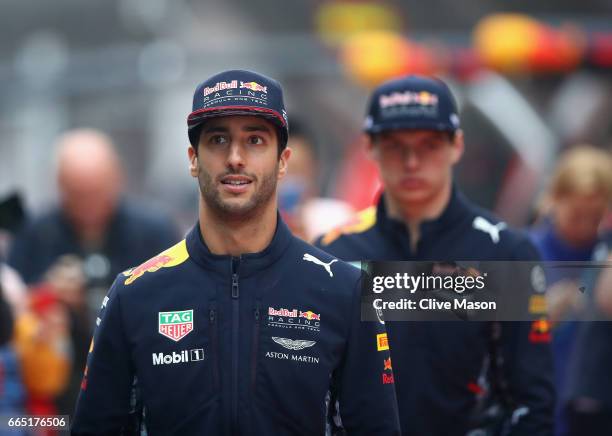 Daniel Ricciardo of Australia and Red Bull Racing and Max Verstappen of Netherlands and Red Bull Racing walk during previews to the Formula One Grand...