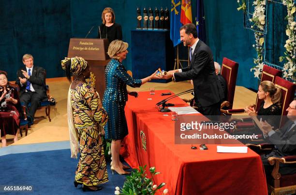 Myriam G. Abrisqueta and Cécile Samagui, representatives of Manos Unidas, 2010 Prince of Asturias Awards laureate for Concord, are presented with the...