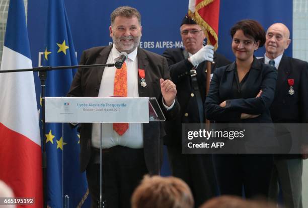 Herve Pizzinat , head teacher of the Alexis de Tocqueville high school, speaks next to French Education Minister Najat Vallaud-Belkacem after being...