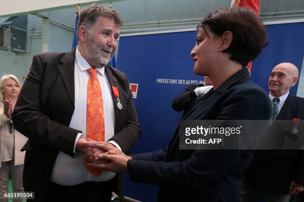 Herve Pizzinat , head teacher of the Alexis de Tocqueville high school, speaks to French Education Minister Najat Vallaud-Belkacem after being...