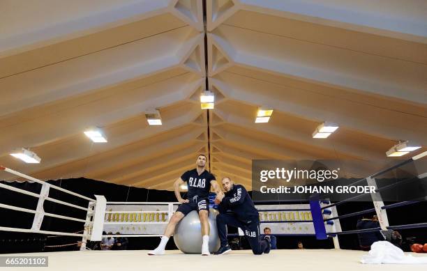 Ukrainian boxer Wladimir Klitschko and his Physio Aldo Vetere are seen during a media training session on April 6, 2017 at the Biohotel Stanglwirt,...