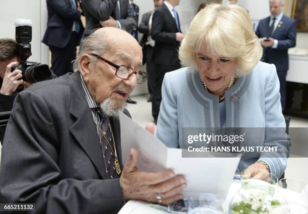 Britain's Camilla, Duchess of Cornwall, talks with a holocaust survivor during a visit of the Jewish Museum on April 6 in Vienna, Austria. / Austria...