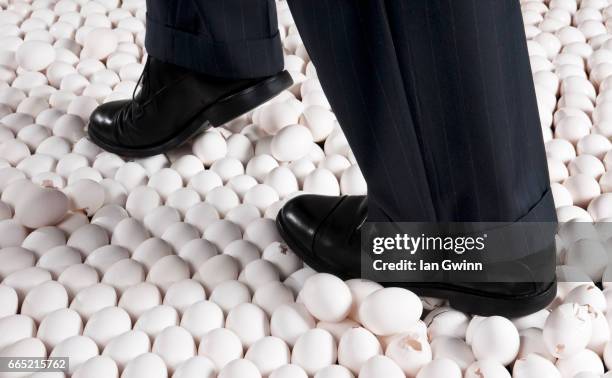 walking on eggshells - ian gwinn stock pictures, royalty-free photos & images