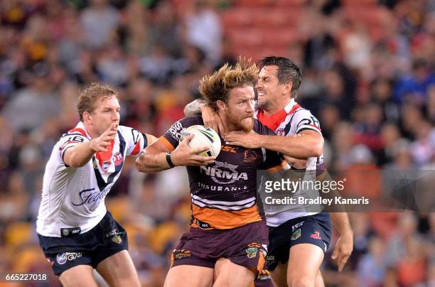 Korbin Sims of the Broncos attempts to breaks away from the defence during the round six NRL match between the Brisbane Broncos and the Sydney...