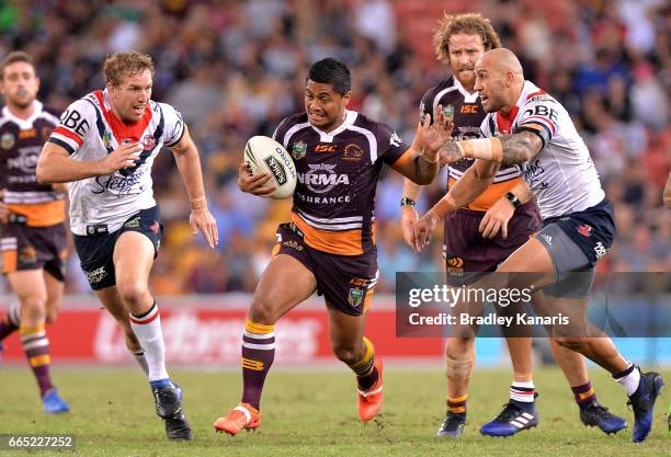 Anthony Milford of the Broncos breaks away from the defence during the round six NRL match between the Brisbane Broncos and the Sydney Roosters at...