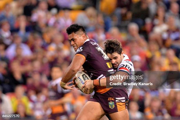 Herman Ese'Ese of the Broncos attempts to break away from the defence during the round six NRL match between the Brisbane Broncos and the Sydney...