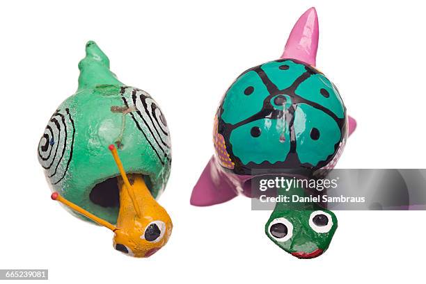 bobble head toy turtle and snail - bobble head isolated stock pictures, royalty-free photos & images
