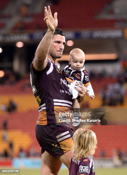 Matt Gillett of the Broncos celebrates victory with his two young children after the round six NRL match between the Brisbane Broncos and the Sydney...