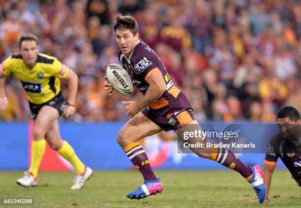 Ben Hunt of the Broncos breaks away from the defence during the round six NRL match between the Brisbane Broncos and the Sydney Roosters at Suncorp...