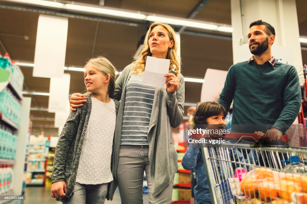 Family shopping in supermarket