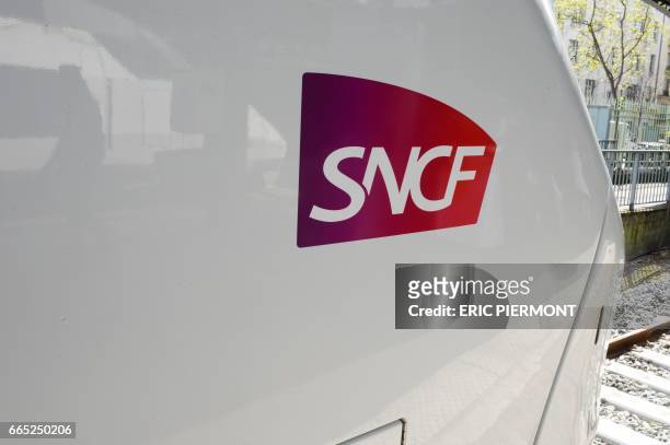 Photo taken on April 6, 2017 shows the SNCF logo on the new Coradia Liner train of SNCF Intercites and train-building giant Alstom presented at the...