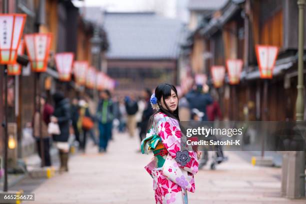 young woman in kimono looking over shoulder - honshu stock pictures, royalty-free photos & images