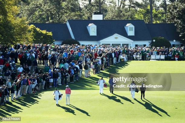 Sean O'Hair of the United States, Sandy Lyle of Scotland and Amatuer Scott Gregory of England walk off the first tee during the first round of the...