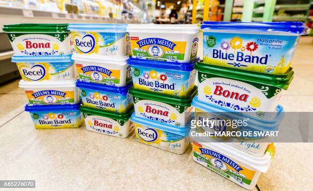 Unilever's margarine brands Becel, Blue Band, Bona and Zeeuws Meisje are displayed in a supermarket in Zwijndrecht, on April 6, 2017. Dutch-British...