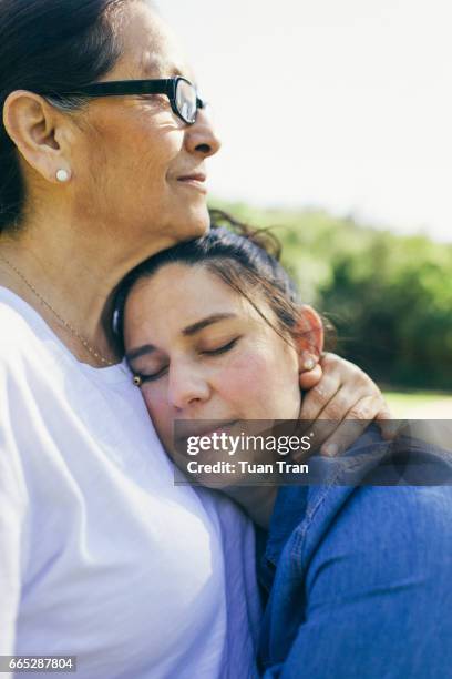 Mother and daughter hugging