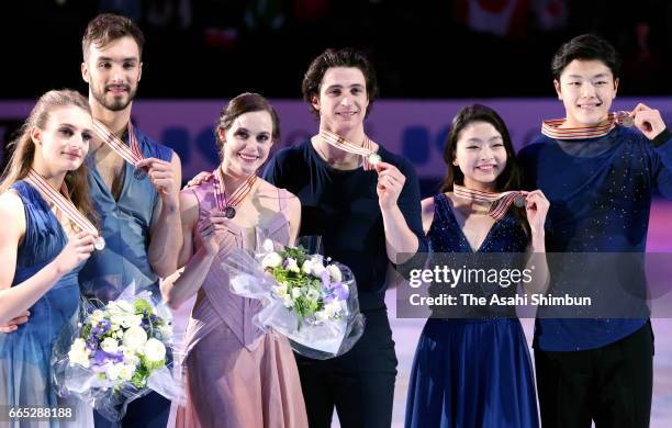 Silver medalists Gabriella Papadakis and Guillaume Cizeron of France, Gold medalists Tessa Virtue and Scott Moir of Canada, bronze medalists Maia...