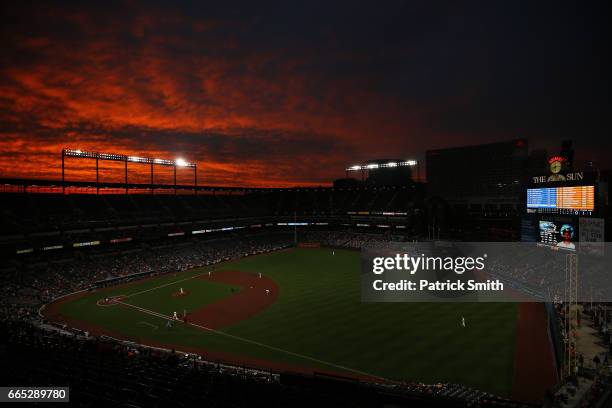 General view as the sun sets during the third inning as the Toronto Blue Jays play the Baltimore Orioles at Oriole Park at Camden Yards on April 5,...