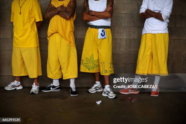 Members of the Mara 18 gang, attend a mass at the Izalco Penitenciary in the city of Izalco, 70 Km west of San Salvador on April 13, 2012. Catholic...