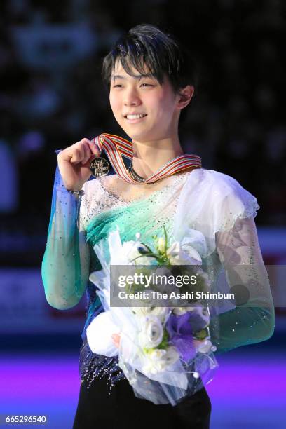 Gold medalist Yuzuru Hanyu poses for photographs at the medal ceremony for the Men's Singles during day four of the World Figure Skating...