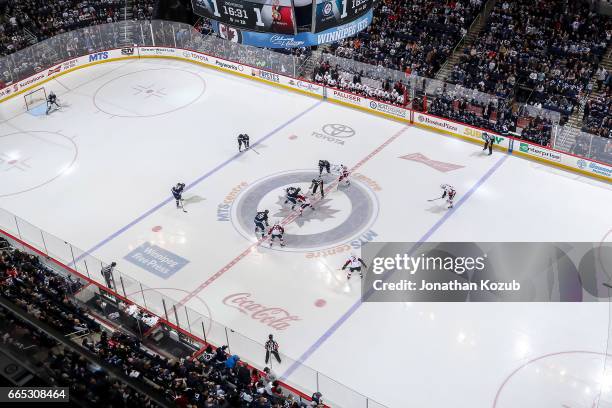 Overhead look of a second period face-off between the Winnipeg Jets and the Ottawa Senators at the MTS Centre on April 1, 2017 in Winnipeg, Manitoba,...