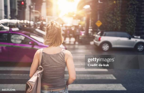 young woman exploring streets of bangkok - bangkok traffic stock pictures, royalty-free photos & images