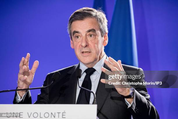 Candidate of Les Republicains right wing Party for the 2017 French Presidential Election Francois Fillon delivers a speech during a press conference...