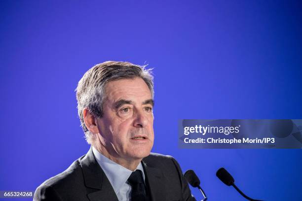Candidate of Les Republicains right wing Party for the 2017 French Presidential Election Francois Fillon delivers a speech during a press conference...