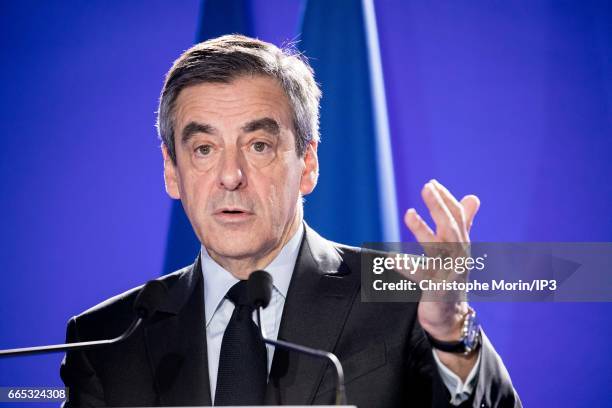 Candidate of Les Republicains right wing Party for the 2017 French Presidential Election Francois Fillon delivers a speech during a press conference...