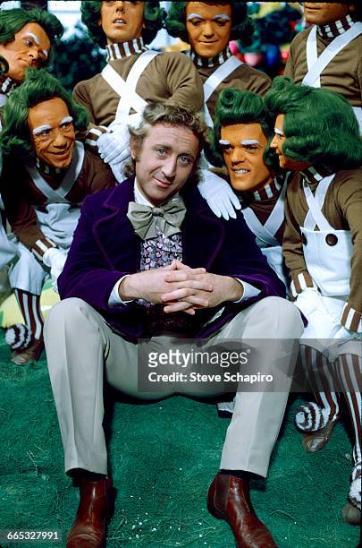Gene Wilder as Willy Wonka surrounded by a group of Oompa Loompas, on the set of the movie Willy Wonka & the Chocolate Factory, 1971.
