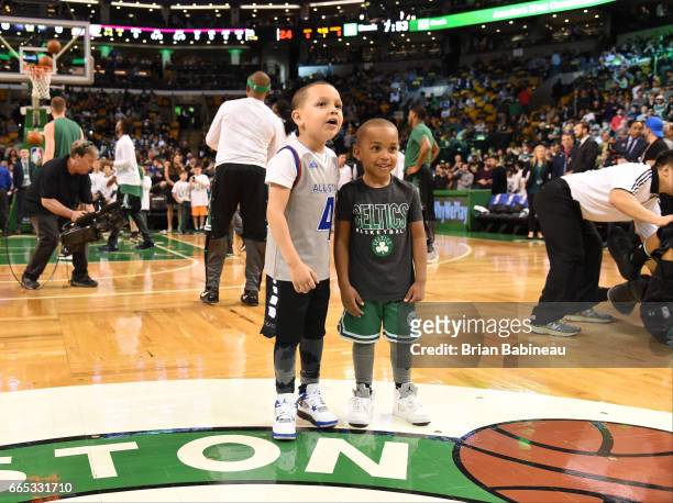 James and Jaiden, sons of Isaiah Thomas of the Boston Celtics takes in the views prior to the game against the Cleveland Cavaliers on April 5, 2017...