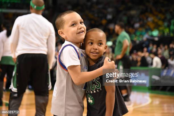 James and Jaiden, sons of Isaiah Thomas of the Boston Celtics takes in the views prior to the game against the Cleveland Cavaliers on April 5, 2017...