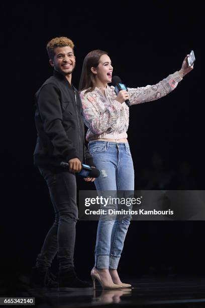 Jordan Fisher and Bailee Madison speak on stage during WE Day New York Welcome to celebrate young people changing the world at Radio City Music Hall...