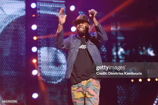 Hip-hop artist Talib Kweli performs on stage during WE Day New York Welcome to celebrate young people changing the world at Radio City Music Hall on...