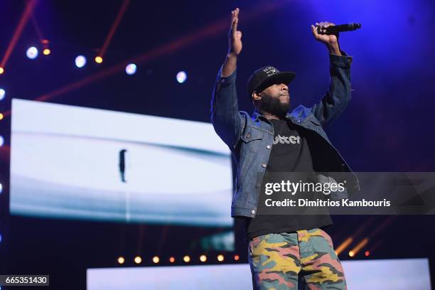 Hip-hop artist Talib Kweli performs on stage during WE Day New York Welcome to celebrate young people changing the world at Radio City Music Hall on...