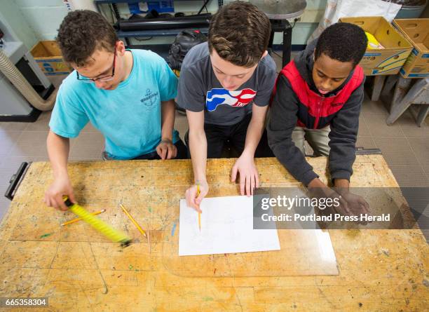 King Middle School students work on an offshore floating wind turbine project on Tuesday, April 4, 2017. Eight-graders Myles Finlay, left, Nathan...