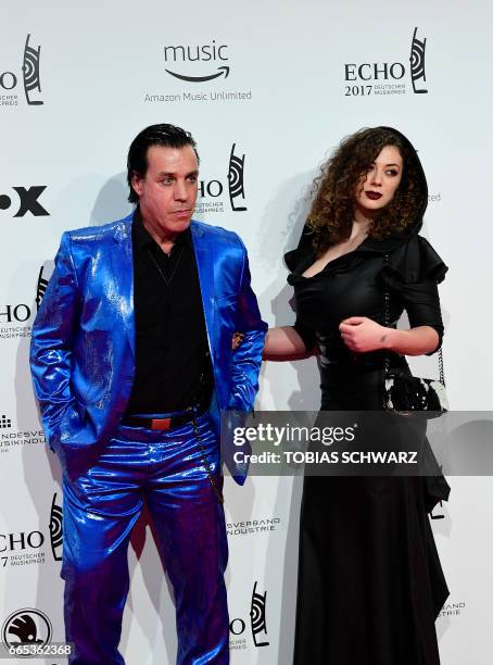 German singer of group Rammstein, Till Lindemann, and friend Leila Lowfire arrive for the 2017 Echo Music Awards in Berlin, on April 6, 2017. / AFP...