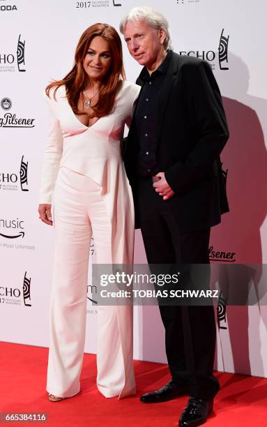 German singer Andrea Berg and husband Ulrich Ferber arrive for the 2016 Echo Music Awards in Berlin, on April 6, 2017. / AFP PHOTO / Tobias SCHWARZ